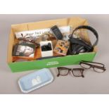 A box of collectables. Tortoise shell glasses, vintage mobile phone, Wedgwood blue jasperware pin