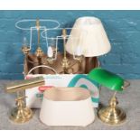 A box of table lamps. Including green glass shade desk lamp, brass examples, etc.