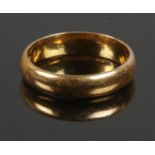 A 22ct Gold wedding band. Size K. Total weight: 3.78g