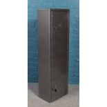 A Brattonsound gun cabinet. Fits seven guns. Height 131cm, Depth 24cm, Width 41cm. With keys and