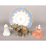 A Dux elephant along with a Rockingham style plate and two porcelain figures, one Royal Doulton