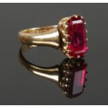 An 18ct Gold and red paste stone ring. Hallmarked for Birmingham. Size N. Total weight: 5.82g