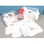 Two boxes of assorted linen. vintage embroided table cloths, napkins, dollies etc