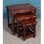 A mahogany nest of 3 scalloped tables on turned legs. Largest table: Height: 56cm Width: 56cm Depth: