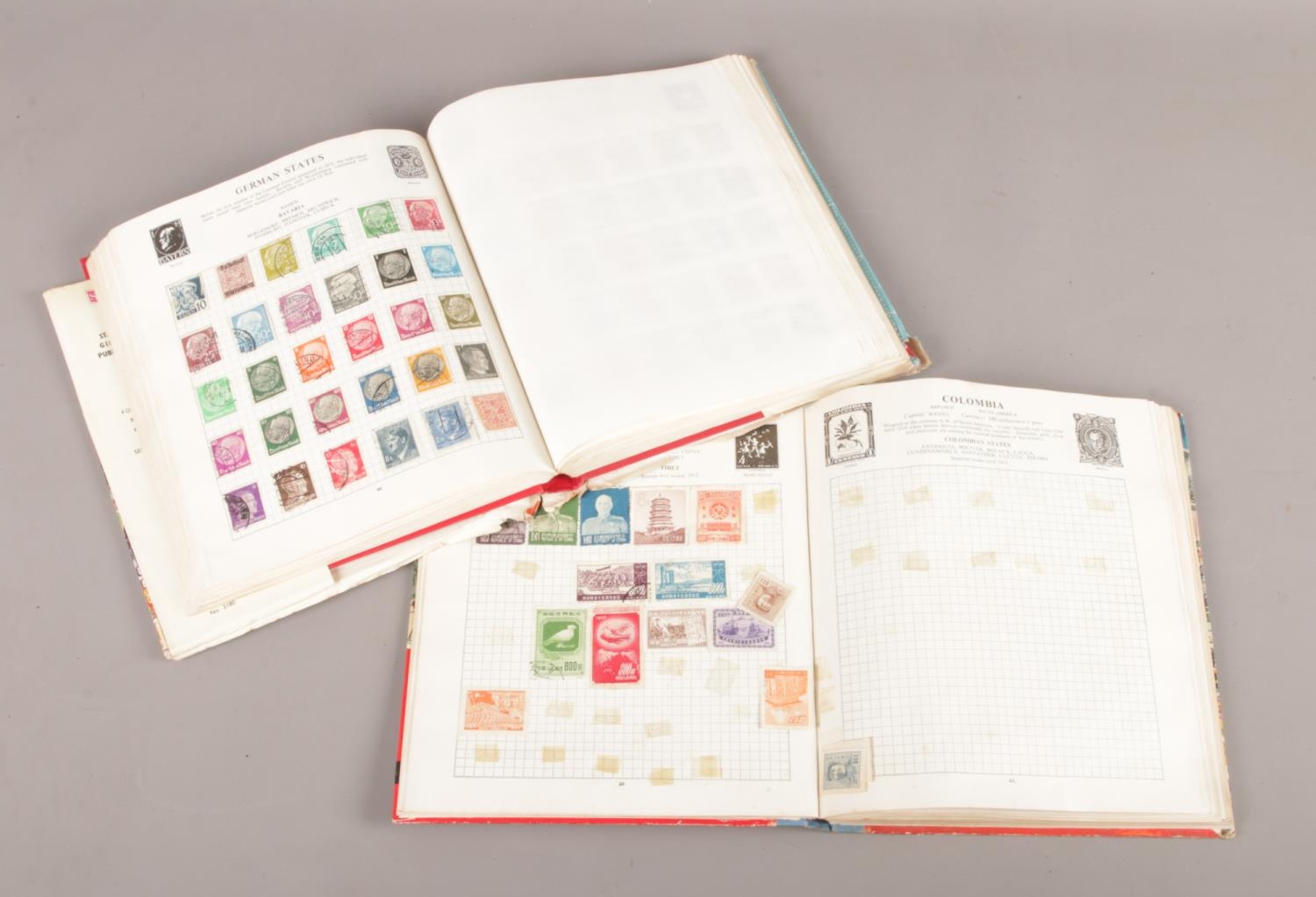 Two Stanley Gibbons stamp albums with contents of world stamps. - Image 2 of 2
