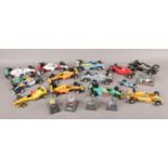 A box of formula 1 Burago diecast vehicles.