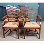 A set of six mahogany Reprodux dining chairs, including two carvers, with fabric seat bases.