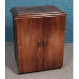 A mahogany sewing chest with four internal drawers, complete with Singer F7219686 sewing machine;