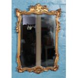 A rectangular rococo style gilt framed mirror. Size of mirror: Height 55cm, Width 38cm.