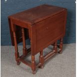 An oak drop leaf gateleg table.