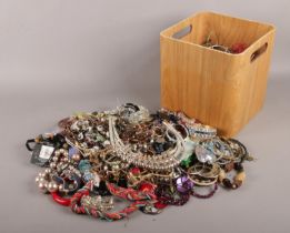 A box of costume jewellery. beads, necklaces, bracelets etc