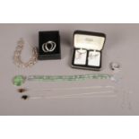 Nine pieces of assorted sterling silver jewellery. To include a boxed necklace and earring set,