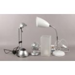 An assortment of three desk lamps along with a small desk fan. Flexible light H: 39cm. Lights in