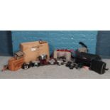 A large selection of vintage photographic equipment. To include camera bags, flash guns, Kodak