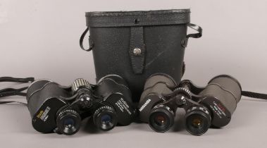 A cased pair of Miranda 10x50mm binoculars, alongside a pair of Boots Admiral II 12x50mm binoculars.