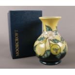 A Moorcroft 'Pears' pottery vase. designed by Debbie Hancock. 16.5cm. marks to base. boxed