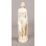 A 1920's carved ivory figure of a nude woman. H: 16.5cm. A repair has been made to the head.