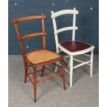 A pair of wooden chairs. One with wicker base and another with vinyl base. H: 85cm, W:37cm, D: