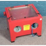 A Sand Blasting cabinet with LED light.