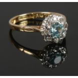 An 18ct Gold and Platinum blue zircon and diamond ring. Size O½. Total weight: 3.22g.