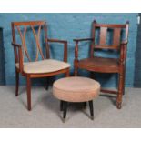 A teak G Plan armchair along with another armchair with leather seat and a G Plan style foot stool.