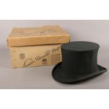 A vintage black silk top hat by Lincoln Bennett. with original collapsible box.