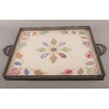 A silver plate butler's tray with tapestry inlay.