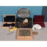 A box of miscellaneous. Including canteen cutlery boxes, large silver plate tray, Tri-ang ships R.