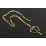 A 9ct Gold and tourmaline heart shaped pendant, on 9ct Gold chain. Total weight: 3.74g