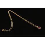A Silver gilt necklace with a Diamond and Ruby pendant. Gross weight 2.29g. Stamped 925 on