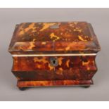 A Victorian tortoise shell tea caddy. 11cm height 14cm width. some missing shell.