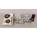 A small collection of trinkets. To include three piece bedroom brush set, glass perfume bottles