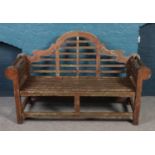 A teak Lutyen style garden bench.