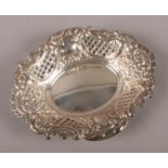 A silver bon bon dish with repousse amd pierced decoration. Assayed Sheffiled 1972 by Cooper