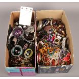 Two large boxes of costume jewellery. Includes beads, bangles etc.