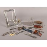A box of assorted collectables. Includes Silver photograph frame (missing back), silver handled