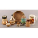 A collection of mainly stoneware advertising items. Includes Royal Doulton 'Dewer's Whisky',