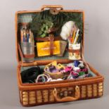 A wicker picnic basket to include costume jewellery etc.