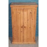 A pine cupboard (101cm x 60cm)