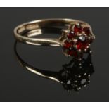 A 9ct gold and garnet ring. Size P. Total weight: 1.40g