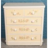 A white painted chest of 2 over 3 drawers with floral decoration. (107cm x 100cm x 48cm)