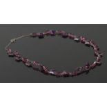 A vintage amethyst paste necklace, set in silver.