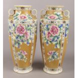 A pair of 20th Century IE & C Co. large Japanese vases, with floral and beaded gilt decoration.