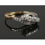 A vintage 18ct Gold and four stone Diamond ring. Size N. Total weight: 2.63g.