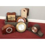 A box of assorted clocks. To include postman's alarm, mantle clocks etc