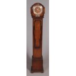 A small dark oak longcase clock, produced by C. W. S Ltd, with later quartz movement. Sterling