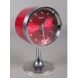 A retro Rhythm drum shaped alarm clock. With chrome support.