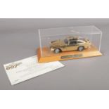 A Danbury Mint 1:24th Scale Gold Plated Finish James Bond Aston Martin DB5. In display case, box &