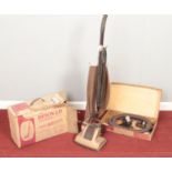 A vintage Hoover Junior. With boxed accessories.