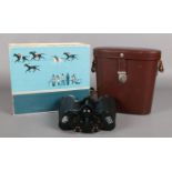 A pair of Carl Zeiss 10x50W Binoculars, complete with leather case and original box.